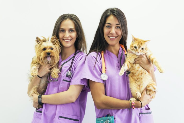 cheerful-women-veterinary-holding-her-pets-.jpg